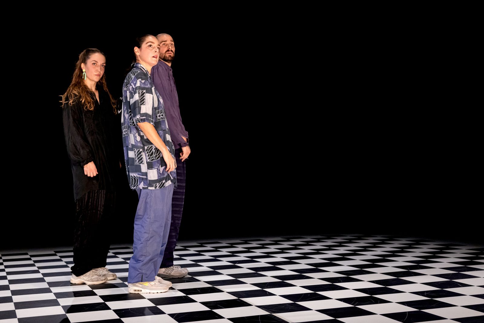 The three dancers of GROOVE standing together on stage